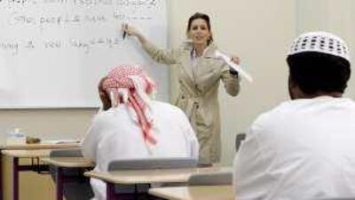 Lina Hejjawi, of the American University of Sharjah's intensive English programme, with a class at the Al Dhaid club.