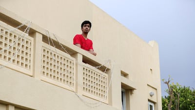 Abhishu Brahmecha, pictured in quarantine at his home in Dubai, returned from university in the United States on Saturday. Officials gave him special dispensation to enter the country when he found himself in limbo. Chris Whiteoak / The National