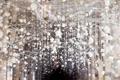 The East Colonnade depicts winter trees, woodland animals and glowing lanterns. EPA