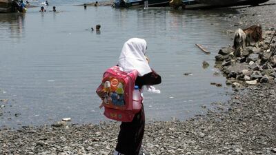 A schoolgirl walks to lessons at the village school in the village of Kumzar located on the Musandam Penisula. Karen Davies / The National