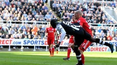 Papiss Cisse scores the opening goal in the match between Newcastle United v Liverpool.