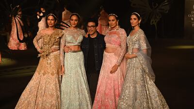 Suneet Varma, centre, poses with models at the end of his fashion show.