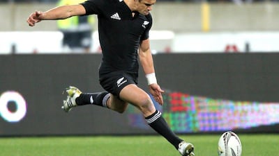 Dan Carter of New Zealand shown kicking a conversion during the 2011 Tri-Nations tournament against South Africa. Carter announced on Thursday he will leave New Zealand after the 2015 Rugby World Cup. Marty Melville / AFP