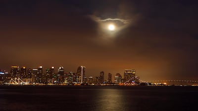 The Super Flower Blood Moon was visible through low clouds above San Diego, California. Reuters