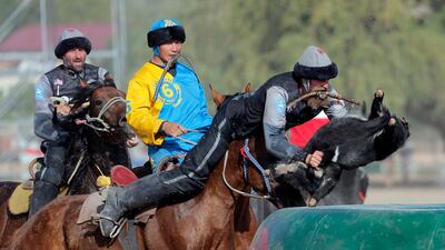 Kazakh and US horsemen take part in kok-boru. EPA