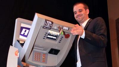 Barnaby Jack gives a demonstration on how automated teller machines can be hacked or "jackpotted".
