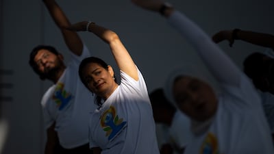 Participants gather under the dome of Louvre Abu Dhabi for a special International Day of Yoga celebration.