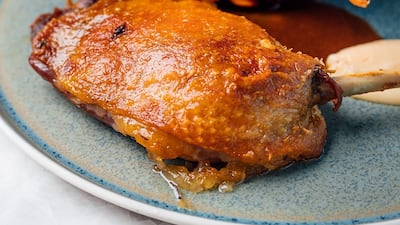 Duck leg confit, pumpkin, baby carrot, orange gastrique from Cyan Brasserie.