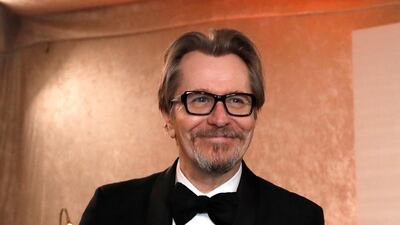 Gary Oldman holds his Oscar after getting it engraved Reuters