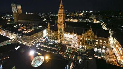 Munich's illuminated townhall during the Christmas market. Reuters / Michael Dalder
