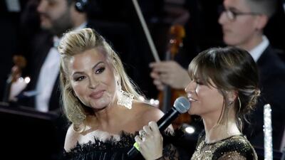 Pop singer Anastacia, left, performs with singer Alessandra Amoroso in the Paul VI Hall at the Vatican during the Christmas concert. AP Photo