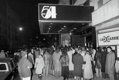 Crowds linger outside the entrance to Studio 54 in New York, November 6, 1979. AP Photo