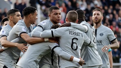 PSG's Neymar celebrates with teammates after scoring. AP