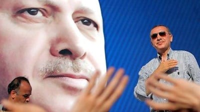 Recep Tayyip Erdogan, Turkey's Prime Minister, greets the supporters of his ruling Justice and Development Party (AKP), during an election rally in Istanbul. Tolga Bozoglu / EPA