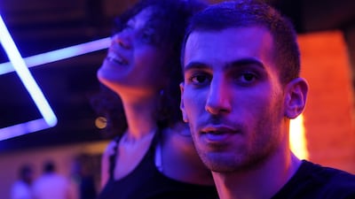 Souna, 25, a business manager, and Karam, 23, a DJ, go bowling with their friends in Damascus, Syria. "I feel like I must either stay this way - careless... or I will go insane," says Karam. Reuters