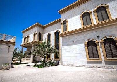 The house's stone-striped arches bring traditional Damascus architecture to Qarayen suburb, Sharjah. Victor Besa / The National
