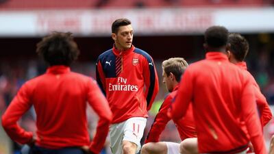 Mesut Ozil of Arsenal warms up ahead of the Premier League match between Arsenal and Crystal Palace at the Emirates Stadium on April 17, 2016 in London, England. (Photo by Paul Gilham/Getty Images)