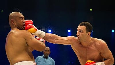 Wladimir Klitschko, right, picked up the 53rd knockout of his career in his 62nd victory in the 65th fight of his career. Bernd Thissen / EPA