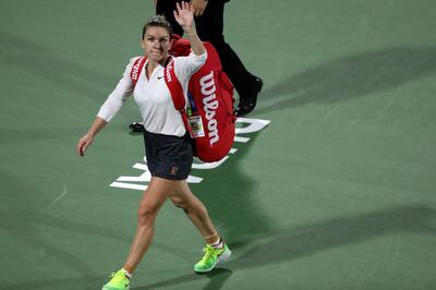 Simona Halep of Romania leaves the court after losing to Switzerland's Belinda Bencic in Dubai on Thursday night. Karim Sahib / AFP
