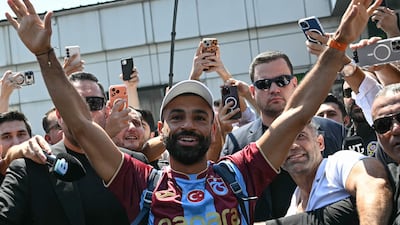 Mohamed Salah waves at fans as he arrives in Turkey to sign with Trabzonspor. Reuters