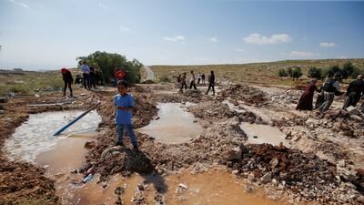 Palestinian pupils stand on the rubble after Israeli bulldozers demolished a school near Bethlehem in the occupied West Bank. Reuters