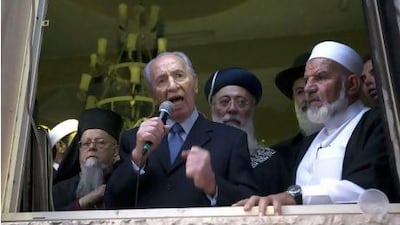 The Israeli president, Shimon Peres (centre), accompanied by Sheikh Mohammed Quwan (right), speaks to residents of the Bedouin village of Tuba Zangaria, in northern Galilee, after inspecting a mosque that was torched overnight yesterday in a suspected revenge attack by right-wing extremists. AFP PHOTO / POOL /MENAHEM KAHANA