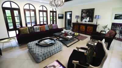 The living area in the Doumanis’ property in The Villa Project is home to a wolf sculpture by French artist Richard Orlinski. Pawan Singh / The National