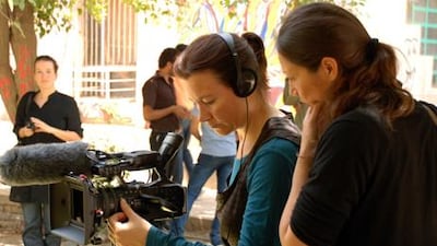 The Dutch filmmaker Shuchen Tan, centre, shooting on location in Baghdad. Her documentary, Baghdad Film School, which screened at DIFF this week, highlights not only the everyday troubles of life in a country reeling from dictatorship, invasion and civil war, but the tremendous risks so often taken by people determined to learn the art of filmmaking.