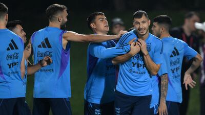 Paulo Dybala, centre, Guido Rodriguez during a training session. AFP
