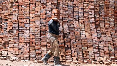 A Yemeni labourer works at a brick workshop on the International Labour Day, in Sana'a, Yemen. EPA