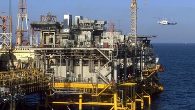 An Aramco helicopter lands on a helipad on the offshore oil rig Marjan 2 in the Arabian Gulf. Reza / Getty Images