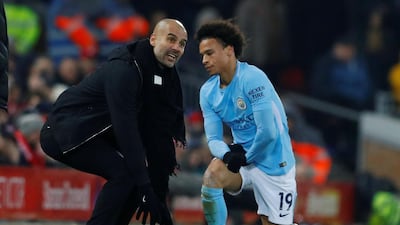 Manchester City manager Pep Guardiola speaks with Leroy Sane during the 4-3 Premier League defeat to Liverpool at Anfield. Phil Noble / Reuters