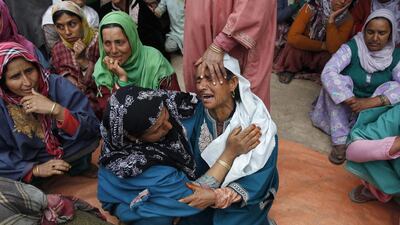 Relatives of Mushtaq Ahmad Mir, an Indian army soldier, mourn during his funeral in Qazipora in the Budgam district of Kashmir, India. Danish Ismail / Reuters