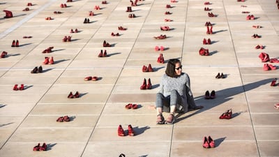 Hundreds of red shoes are displayed on the ground to protest against violence toward women in Israel in Tel Aviv's Habima Square on Dec. 4, 2018. Heidi Levine/Sipa Press