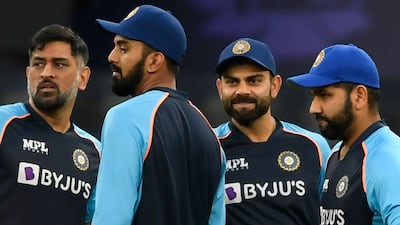 Virat Kohli, second right, captained the India T20 side for the final time on Monday with a win over Namibia. Teammate Rohit Sharma, right, is tipped to replace him. AFP