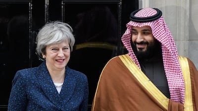 Saudi Crown Prince Mohammed bin Salman stands with British prime minister Theresa May on the steps of Number 10 Downing Street in London, England. Leon Neal / Getty Images