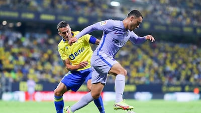Barcelona's Sergiño Dest competes for the ball with Salvi Sanchez of Cadiz. Getty Images