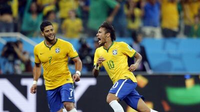 Hulk, left, and Neymar, right, celebrate during one of Brazil's goals in their World Cup 2014 opener against Croatia. Frank Augstein / AP / June 12, 2014