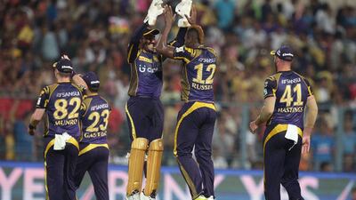 Kolkata Knight Riders cricketer Andre Russell, centre right, celebrates the wicket of Delhi Daredevils cricketer Shreyas Iyer during the 2016 Indian Premier League (IPL) Twenty20 cricket match at the Eden Gardens Cricket Stadium in Kolkata on April 10, 2016. AFP / Dibyangshu SARKAR