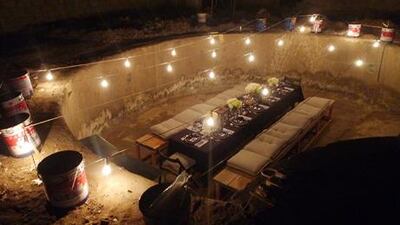 A dinner was held in an empty swimming pool, complete with custom-made benches.