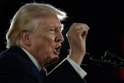 US President Donald Trump addresses the National Republican Congressional Committee's annual fundraising dinner in Washington on March 25. Senior Iranian figures say there have been no negotiations with the US but messages were exchanged. AFP