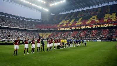 AC Milan and Internazionale players line-up in the San Siro stadium the clubs share before the Champions League semi-final first leg in 2003