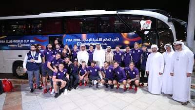 River Plate players and staff pose for photos with UAE officials after arriving at Abu Dhabi Airport ahead of the Fifa Club World Cup. EPA