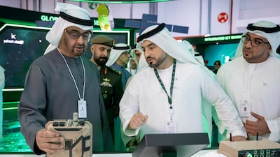 President Sheikh Mohamed visits a booth at Idex