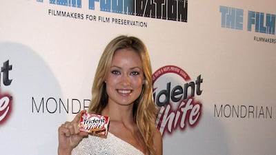 Olivia Wilde exemplifies mid-2000s style in a white knit with blue jeans at The Trident White Black and White party at the Skybar Mondrian Hotel, Hollywood, on February 25, 2005.