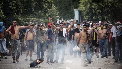 Demonstrators in Venezuela’s Tachira state confront members of the national guard during a protest on December 17, 2016 against the government’s sudden withdrawal of the country’s most widely used currency note. Carlos Becerra / Bloomberg