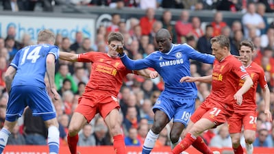 Liverpool's Steven Gerrard (2nd l) and Lucas Leiva challenge Chelsea's Demba Ba (C) during the Premier League match at Anfield on April 27, 2014. AFP