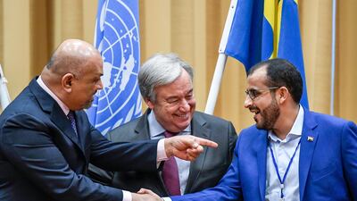 Head of the Houthi delegation, Mohammed Amdusalem (right) and Yemen Foreign Minister Khaled Al Yaman (left) shake hands with UN Secretary General Antonio Guterres, during Yemen peace talks. Pontus Lundahl / AP