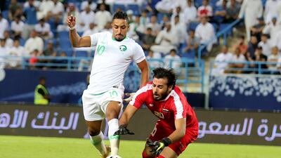 Saudi Arabia's Salem Al-Dawsari rounds Iraq's goalkeeper Mohammed Hassan Hameed Farhan. EPA