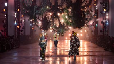 Models wear creations as part of the Palm Angels Fall/Winter 2022-2023 fashion collection, unveiled during the Fashion Week in Milan, Italy. AP Photo